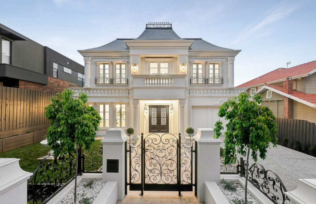 Grand luxury home with classical architecture, ornate wrought iron gates and manicured landscaping, premium house in Camberwell.