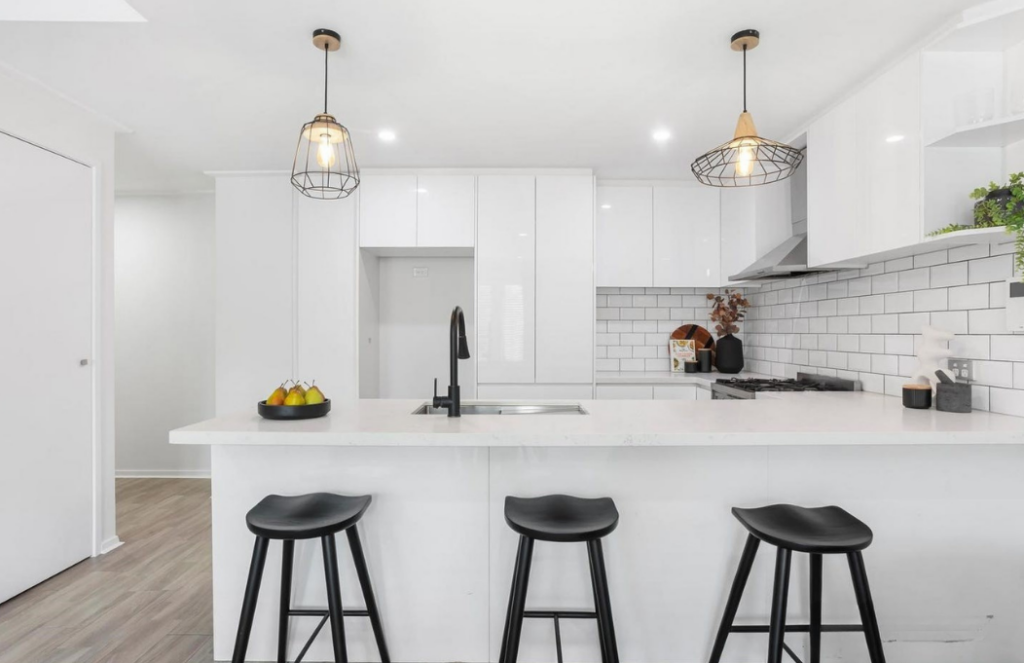 modern marbled white kitchen in hawthorn. staged with contemporary style black stools to match with contrasting elements of kitchen. 3122