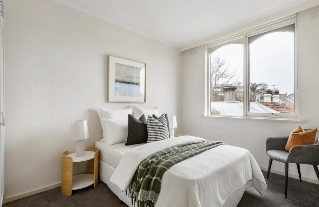 hawthorn second bedroom property stage, nature window brining in light, white walls