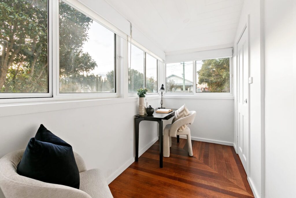 rich mahogany timber floors, with white walls and natural light. Staged office space in Coburg 3058.