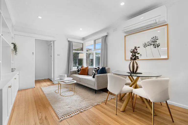 a staged unit lounge room with modern elements such as bright colours and grey midtones in Murrumbeena.